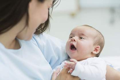 Mother holding a baby.