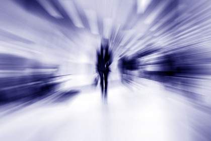 Blurred image of person walking toward camera Blurred image of person walking toward camera.