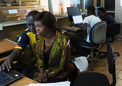 West Africans working on a computer. West Africans working on a computer.