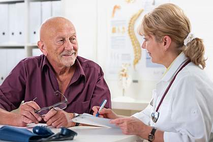 Older man talking to doctor Older man talking to doctor.