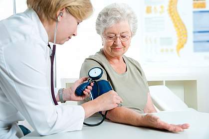 Female doctor measuring blood pressure of senior woman Female doctor measuring blood pressure of senior woman.