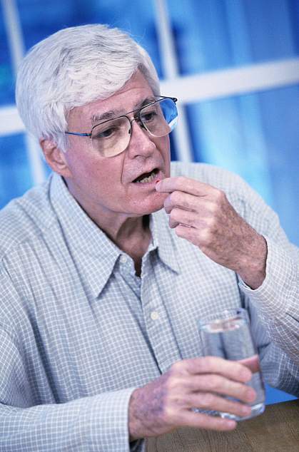 Man taking a pill. Man taking a pill.