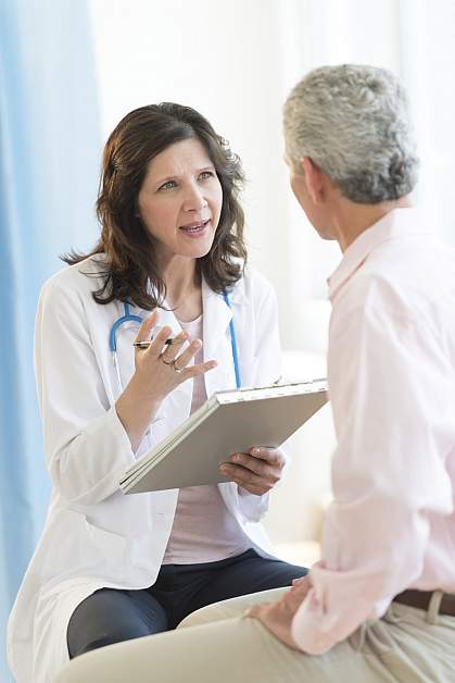Man talking to doctor. Man talking to doctor.