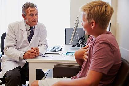 Teenage boy in consultation with doctor Teenage boy in consultation with doctor.