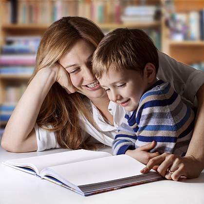 A mother and young son enjoying reading time. A mother and young son enjoying reading time.