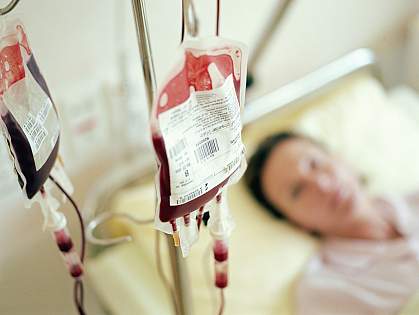 blood transfusion Woman in hospital bed getting blood transfusion