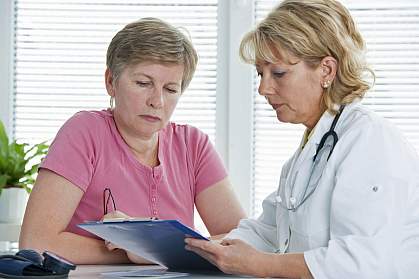Interpreting Breast Biopsies Woman consulting with her doctor