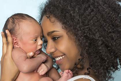 Smiling mother and baby