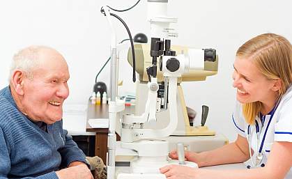 Older man getting an eye exam Older man getting an eye exam