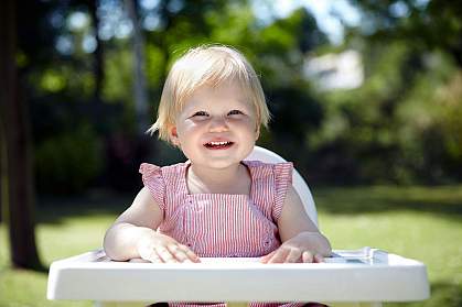 Baby waiting for lunch in a garden Baby waiting for lunch in a garden
