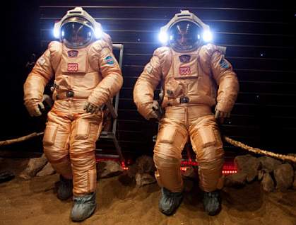 Crew members in spacesuits Crew members in spacesuits