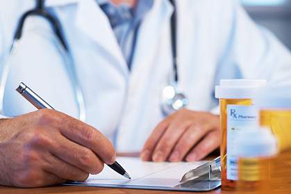 Doctor writing a prescription Doctor writing a prescription