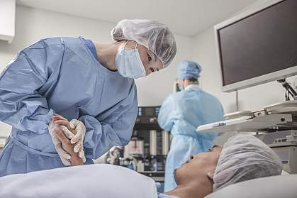 Surgeon holding a patient’s hands as they prepare for surgery Surgeon holding a patient’s hands as they prepare for surgery.