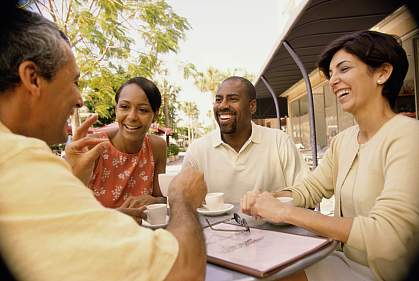 Two middle-aged couples at an outdoor café Two middle-aged couples at an outdoor café
