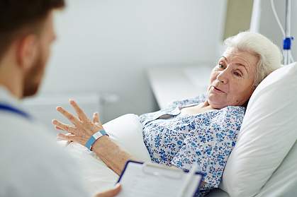 Older woman in hospital bed Older woman in hospital bed