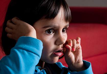 Young girl reacting with emotion to something she sees Young girl reacting with emotion to something she sees
