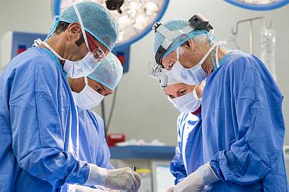 Team of surgeons operating Team of surgeons operating