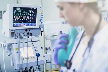 Nurse monitoring patient’s vitals Nurse monitoring patient’s vitals