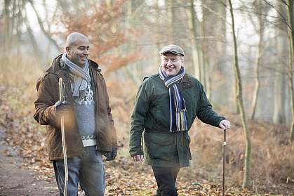 Two older men on a winter walk. Two older men on a winter walk.