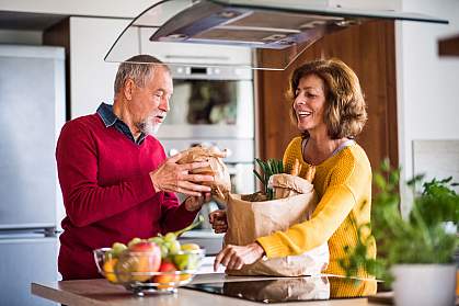 Senior couple preparing healthy food