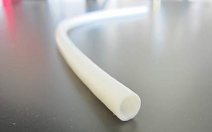 Close-up of narrow white tube. Close-up of narrow white tube.