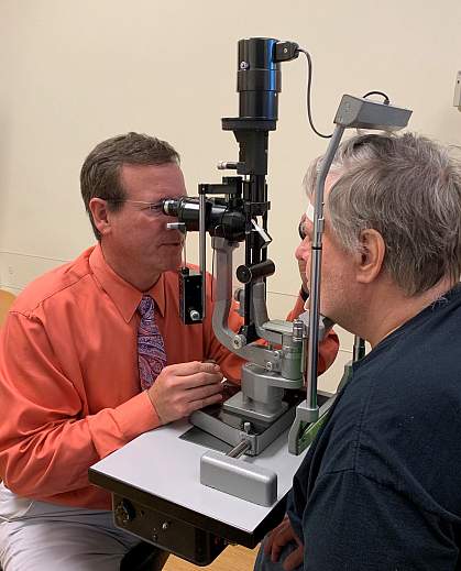 Doctor and participant in eye exam Doctor and participant in eye exam