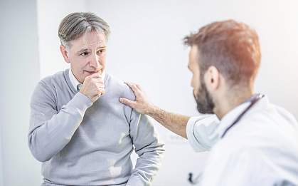 Man talking to doctor Man talking to doctor