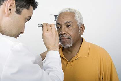 African American man getting eye exam African American man getting eye exam