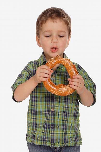 Boy with large sesame seed bagel Boy with large sesame seed bagel