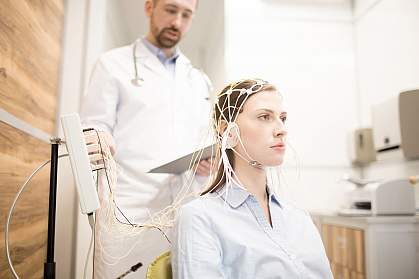 Young woman undergoing electroencephalography Young woman undergoing electroencephalography