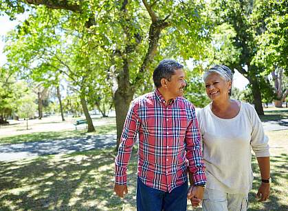 Adult couple walking outdoors Adult couple walking outdoors
