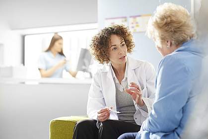 Doctor speaking with older woman Doctor speaking with older woman