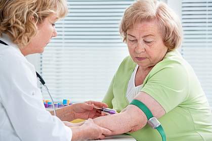 Older woman getting her blood drawn