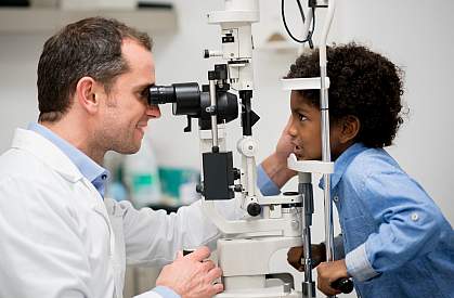 Boy getting an eye exam Boy getting an eye exam