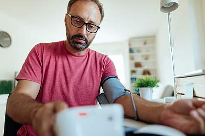 Man checking blood pressure