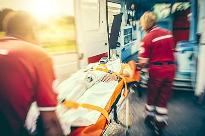 Rescue team bringing person to ambulance Rescue team bringing person to ambulance
