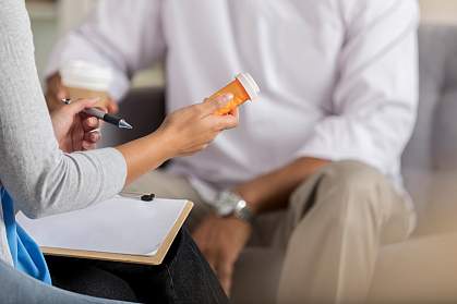 Health professional discussing prescription medication with patient Health professional discussing prescription medication with patient