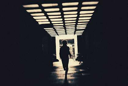 Person in shadow running through creepy underpass Person in shadow running through creepy underpass