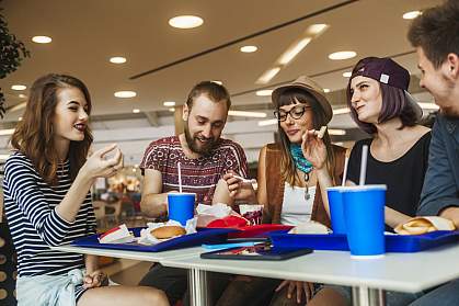Hipster friends in mall eating fast food Hipster friends in mall eating fast food