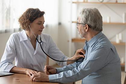 Doctor listening to a patient’s heart with a stethoscope Doctor listening to a patient’s heart with a stethoscope