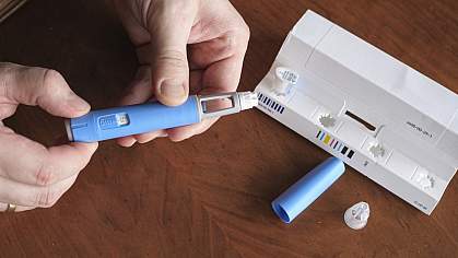 Closeup of hands preparing a semaglutide injection. Closeup of hands preparing a semaglutide injection.