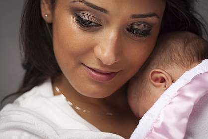 Woman holding newborn. Woman holding newborn.