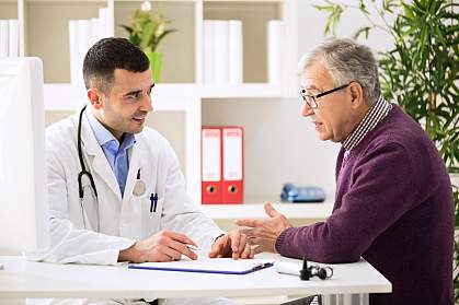 Doctor talking to older male patient. Doctor talking to older male patient.