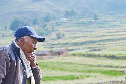 Pensive older Native American man in the countryside. Pensive older Native American man in the countryside.