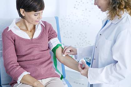 Doctor preparing a woman’s arm for a blood test. Doctor preparing a woman’s arm for a blood test.