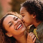 Mother and daughter laughing together.