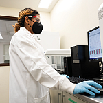 Image of a student researcher working at computer