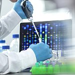 Image of a scientist using a pipette to conduct a genetic analysis