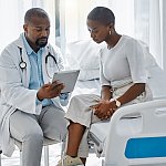 Image of a woman talking with her doctor.