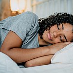 Teen sleeping in a bed